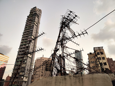 Old fashioned condominiums and antennas in Mong Kok district, Kowloon Peninsula. Hong Kong