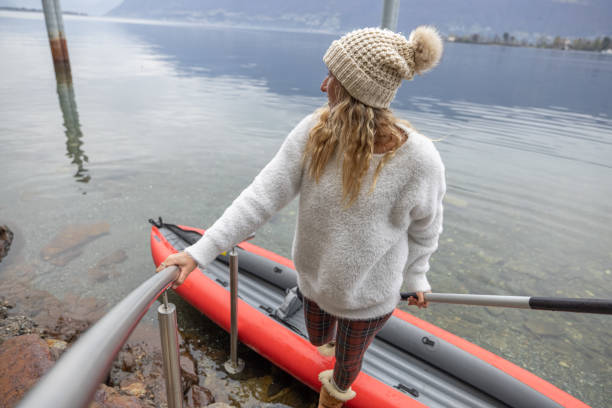 istock Woman docking and getting out of red canoe 1478296693