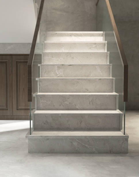 istock Modern, luxury, U shape white marble staircase, tempered glass panel balustrades, wood handrail with storage room under stair in elegant marble wall and floor house 1478296729