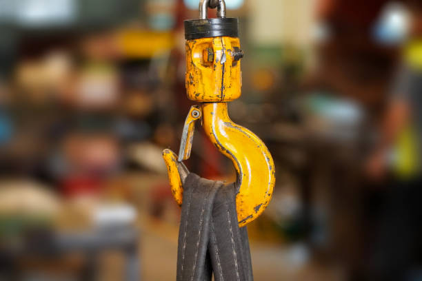 istock Yellow crane hook with belt in factory industry background 1478296844