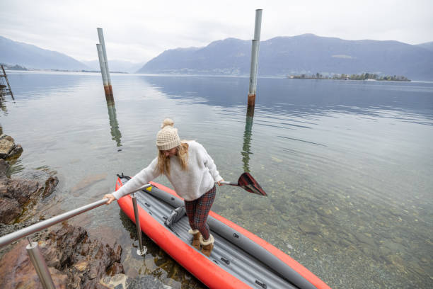 istock Woman docking and getting out of red canoe 1478296898