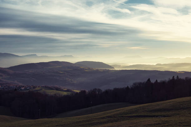 Mont Salève, France - December 25, 2022. View of the sunset over the snows of the French Alps in the heart of Haute-Savoie, on the heights of the city of Annecy bathed in a sea of clouds