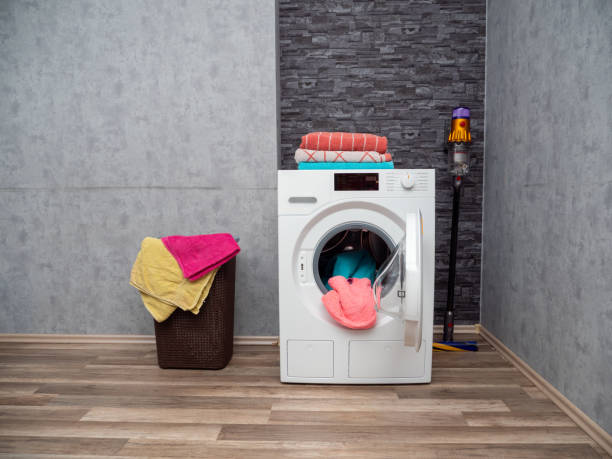 istock Laundry room interior with washing machine against the wall. 1478297963