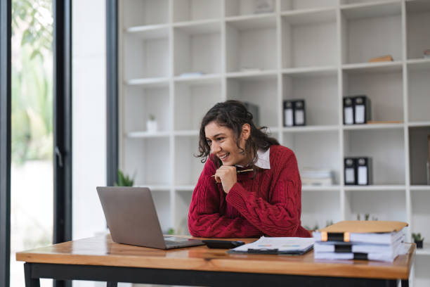istock Businesswoman read data on document to analysis marketing plan. Online remotely or webinar 1478300030