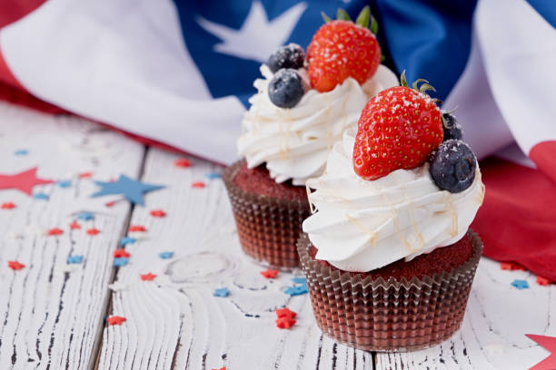 istock Sweet cupcakes with blueberries and strawberry , flag background 1478300585