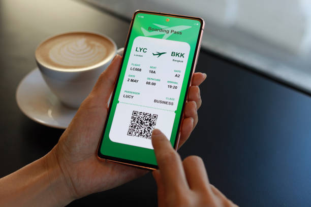 istock The view shows a young woman checking her electronic flight ticket on her mobile phone and checking in with her mobile boarding pass. 1478302278