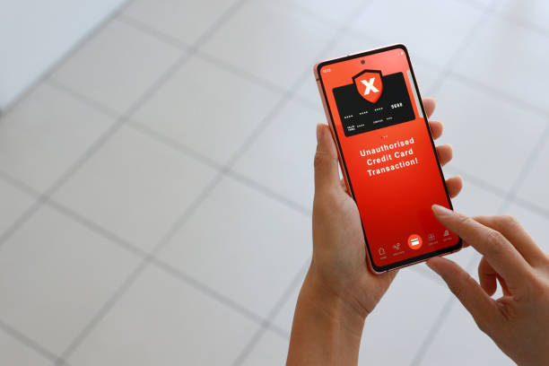 istock A woman received an alert message from her bank regarding an unauthorized credit card transaction on her phone. 1478304457