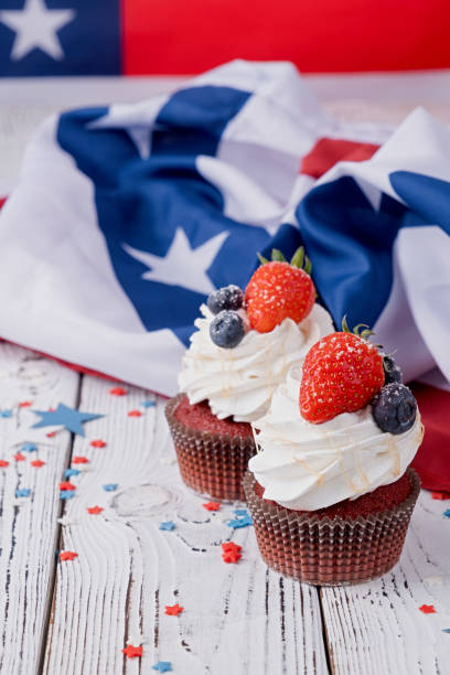 istock Sweet cupcakes with blueberries and strawberry , flag background 1478305553