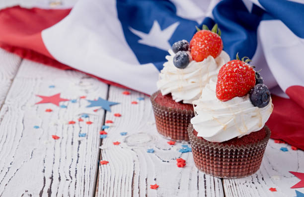 istock Sweet cupcakes with blueberries and strawberry , flag background 1478305578