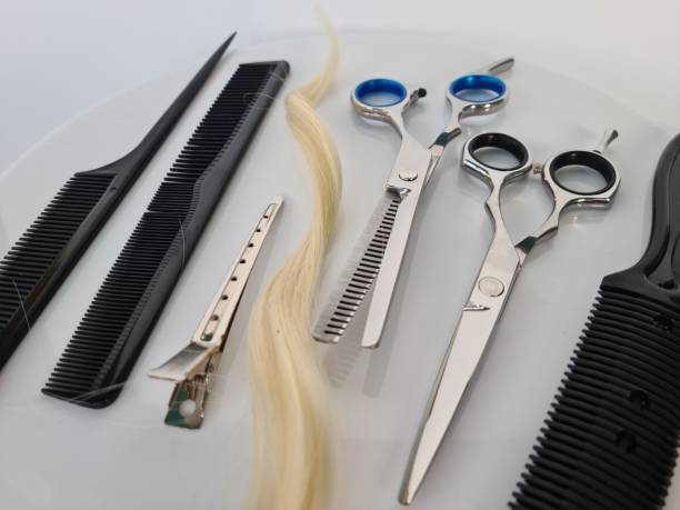 istock Set of scissors and combs and hair 1478305579