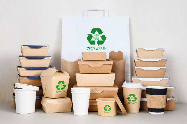 istock Waste reduction. The concept of life with zero waste. Eco-friendly paper disposable tableware with a recycling symbol. 1478309997