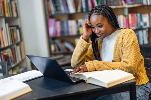 istock Female Student Working On Laptop In College Library 1478315986