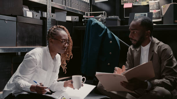 istock Private investigators doing detective work with records 1478316501