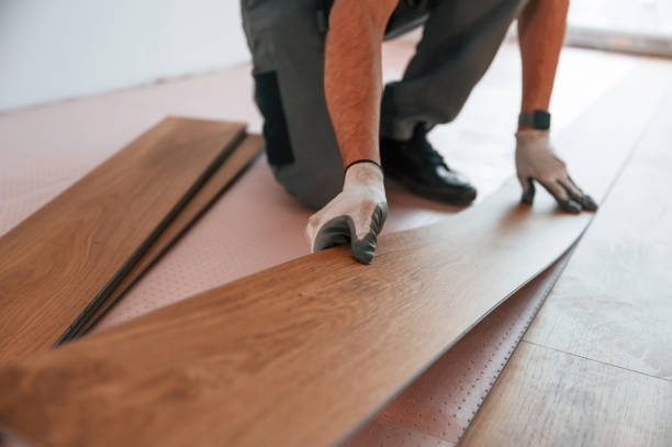 istock Close up view. Man is installing new laminated wooden floor 1478316921