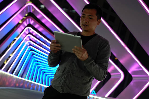 Asian business men use tablets on the overpass