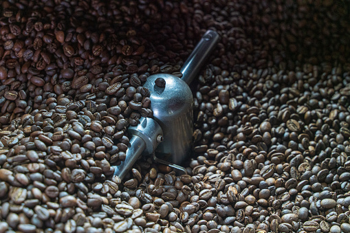 Coffee beans spoon and Cup in flight.