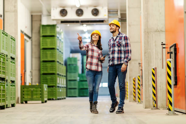istock A manager walking around with businessman and showing him around facility. 1478320076