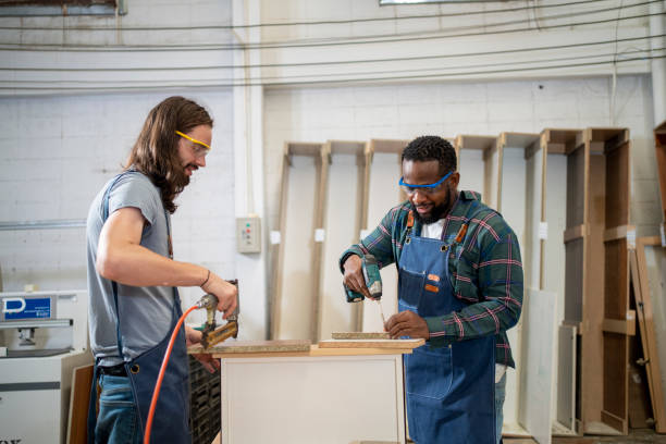 istock Two carpenter man working in factory 1478321328