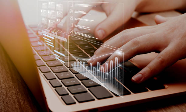 istock Business data management system concept background. Business person working on computer updating tasks and milestones progress, complete the online survey form. 1478321739