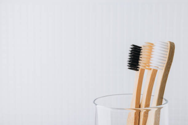 istock Bamboo toothbrushes. Eco friendly bamboo toothbrushes in glass close-up, copy space. 1478323904