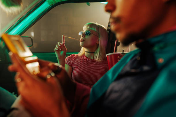 istock Cool retro couple in car. 1478324868