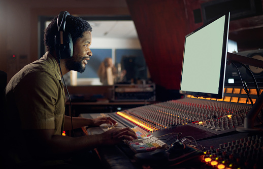 Happy, musician or technology mockup screen in music recording, sound mixing or studio song composition. Producer, happy or black man with computer headphones for dj radio, audio mock up or media app