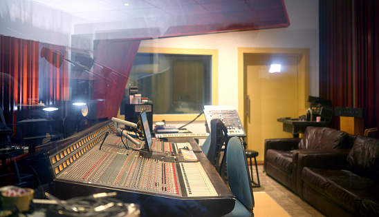 View of mixing desk in recording studio.