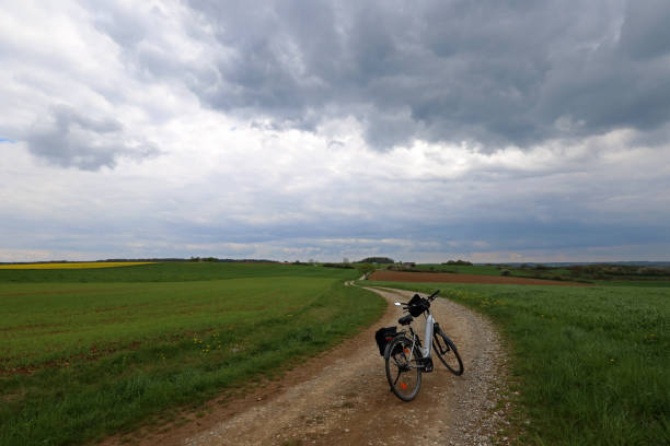 Spring landscape before a thunderstorm. Bike ride. stock photo