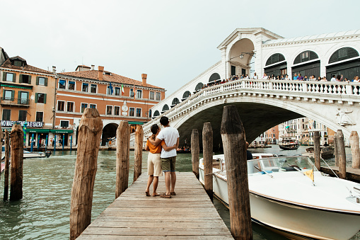 Romantic asian couple in honeymoon in Venice, Italy.