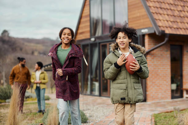 istock Happy black siblings running in the backyard. 1478340177