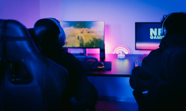 istock Young gamers having fun playing on decentralized NFT gaming blockchain platform at home - Gaming entertainment and new technology concept 1478340774