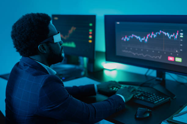 istock Financial analyst working on NFT blockchain technology with futuristic virtual reality glasses in office - Fintech concept 1478340810