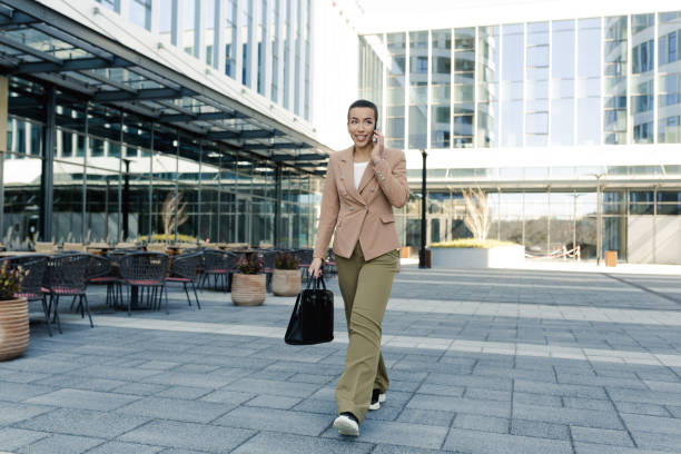 istock Young woman using smartphone on the street 1478342039