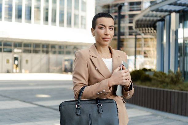 istock Young woman using digital tablet on the street 1478342059