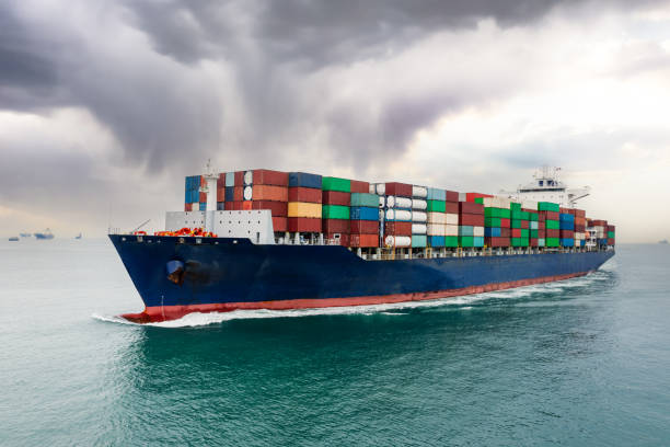 istock container ship sailing to transport goods in containers for import export internationally and worldwide, business services transportation by container ship open sea, front view from drone, storm background, 1478342455