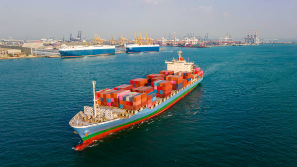 istock cargo container ship carrying in sea to import export goods and distributing products to dealer and consumers across asia pacific worldwide, global business and industry delivery service  by container ship Transport. 1478342649