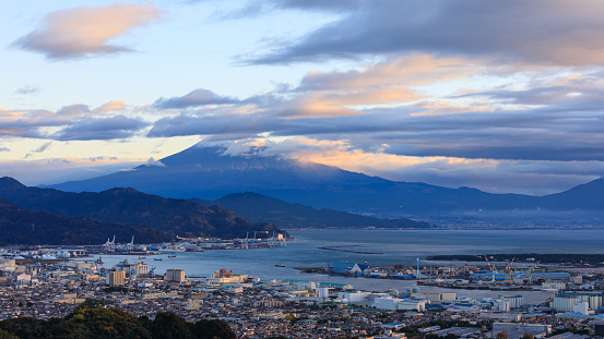 Cityscape at morning view and industry zone shipping port import export international and fuji mountain background in japan