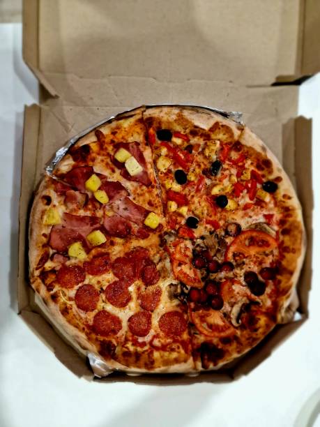 istock pizza in a box lies on a table in a cafe 1478351771