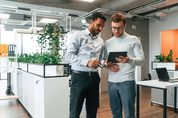 istock Two men are working in the modern office together 1478356968