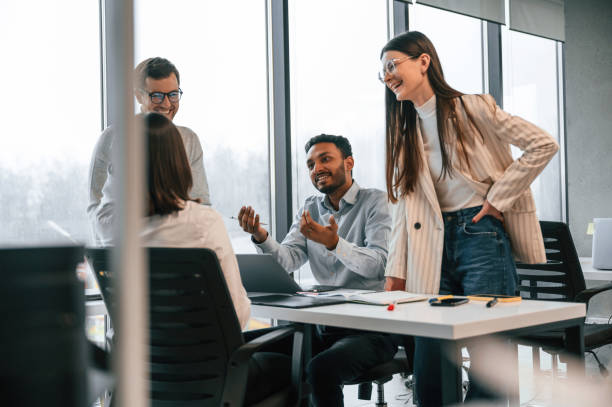 istock Conception of brainstorming. Four people are working in the office together 1478357167