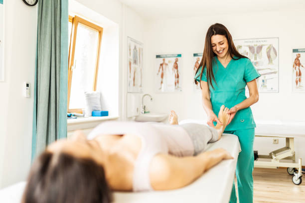 istock Physical therapy ,female patient with chiropractor having foot pain 1478358565