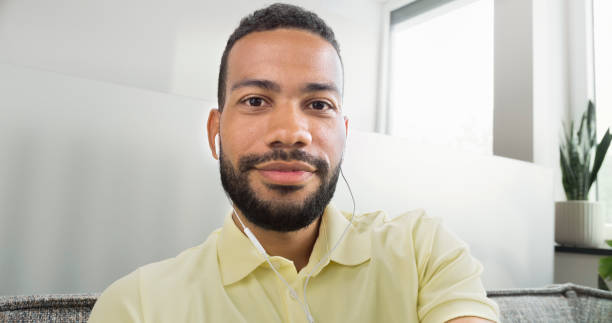 istock Man wearing headphones 1478358810