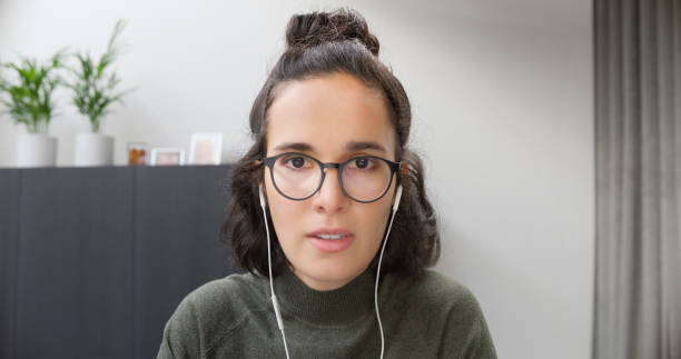 istock Woman wearing headphones 1478358832