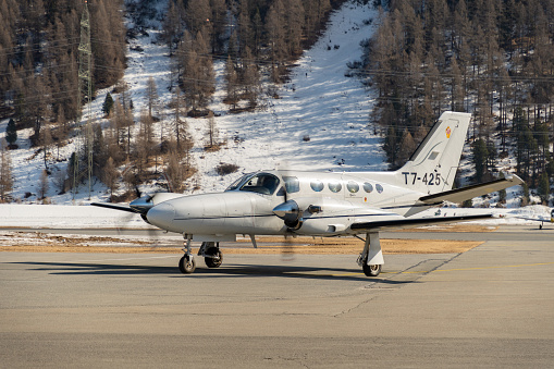 Samedan, Switzerland, February 21, 2023 Cessna 425 Conquest multi engine propeller aircraft is taxiing to its position