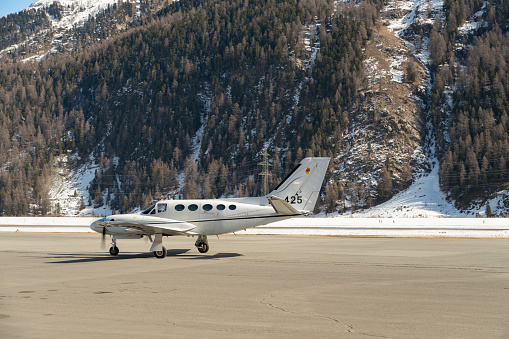 Samedan, Switzerland, February 21, 2023 Cessna 425 Conquest multi engine propeller aircraft is taxiing to its position