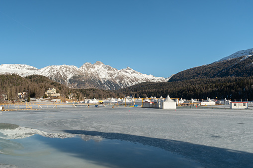 Saint Moritz, Switzerland, February 21, 2023 Frozen lake of Saint Moritz and a magnificent alpine panorama on a sunny day