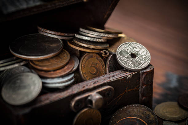 istock Old coins in a vintage container. 1478363007