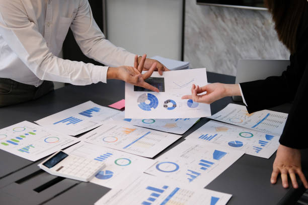 istock Businessman and team analyzing financial statement Finance task. with tablet and .calculator. Wealth management concept 1478363171
