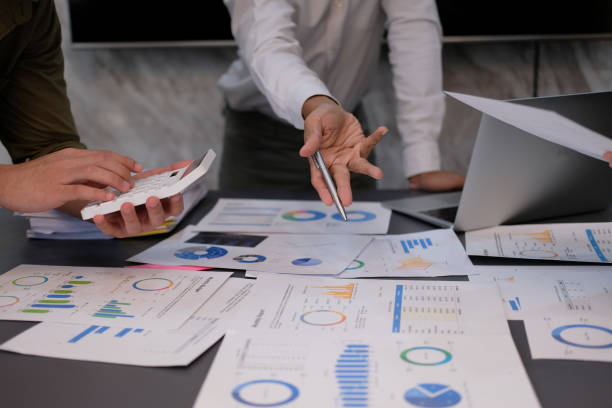 istock Businessman and team analyzing financial statement Finance task. with tablet and .calculator. Wealth management concept 1478363204