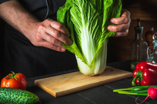 istock A professional chef makes a fresh napa cabbage salad. Preparation for slicing in the restaurant kitchen. Vegetable diet idea 1478364515